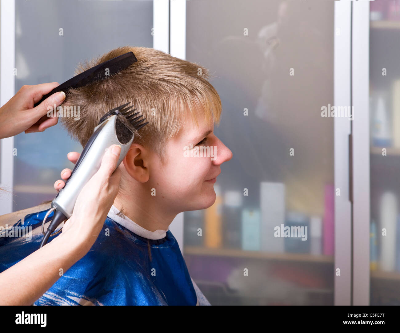 The happy teenager in hairdresser's salon Stock Photo Alamy