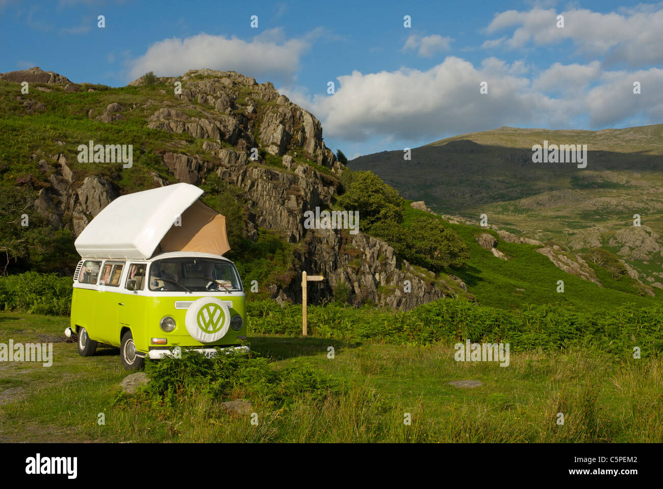 VW camper van parked in rocky landscape in the Duddon Valley, Lake District National Park, Cumbria, England UK Stock Photo