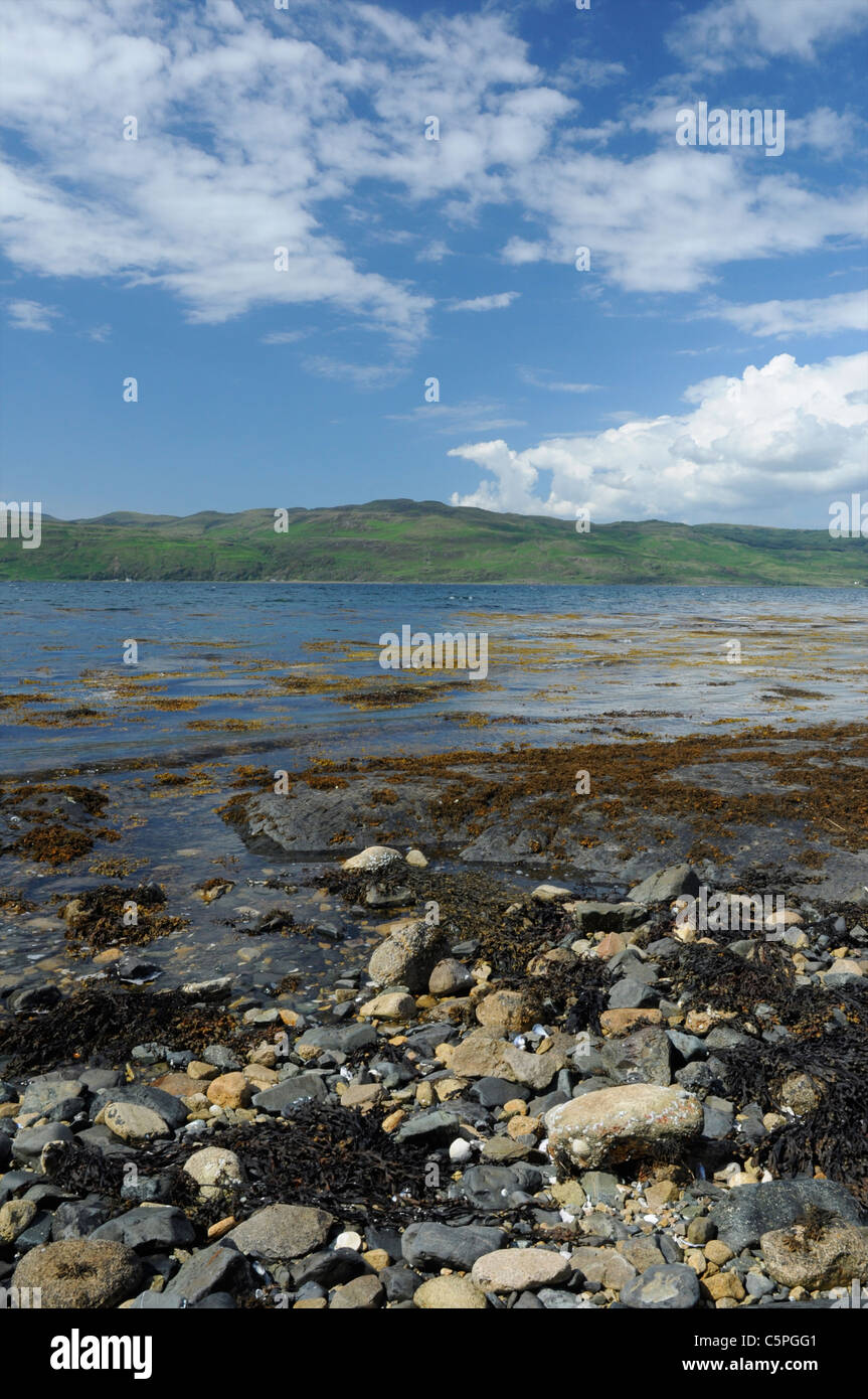 Rocks and stony shore along the south bank of Loch na Keal, Isle of Mull, Argyll, Scotland, UK Stock Photo