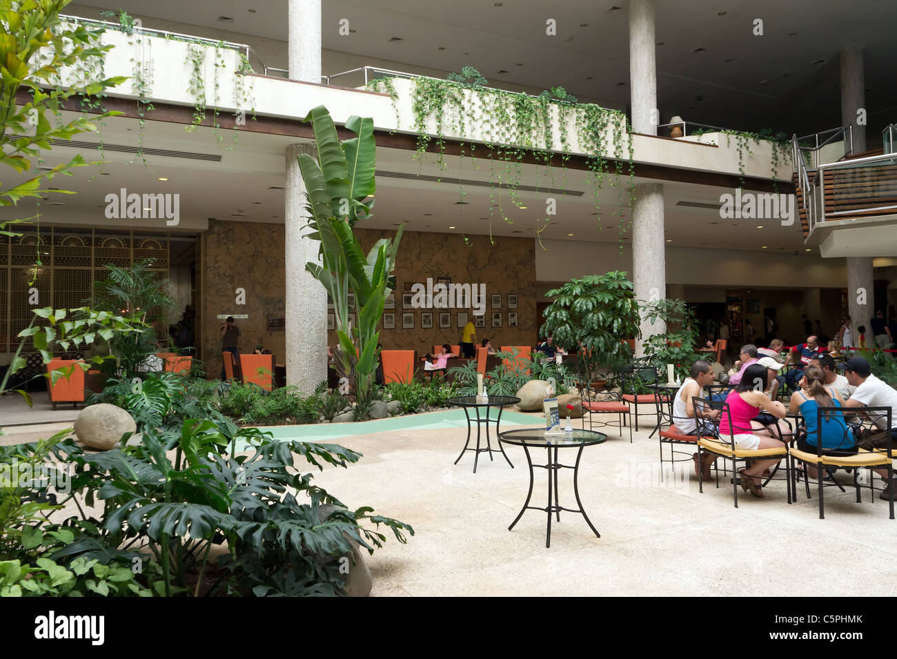 Central lobby of the Hotel Habana Libre, the old Havana Hilton, Cuba. Castro effectively ran Cuba from here after the Revolution Stock Photo