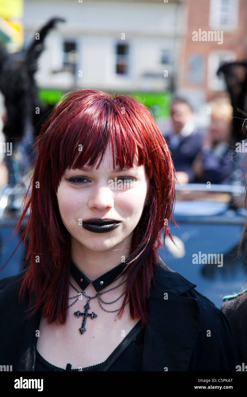 Whitby, Yorkshire, England, teen girl in gothic emo dress teen angst black lips crucifix pale skin Stock Photo