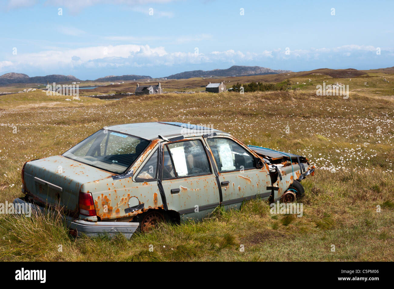 An abandoned car on the island of Flodaigh in the Outer Hebrides Stock