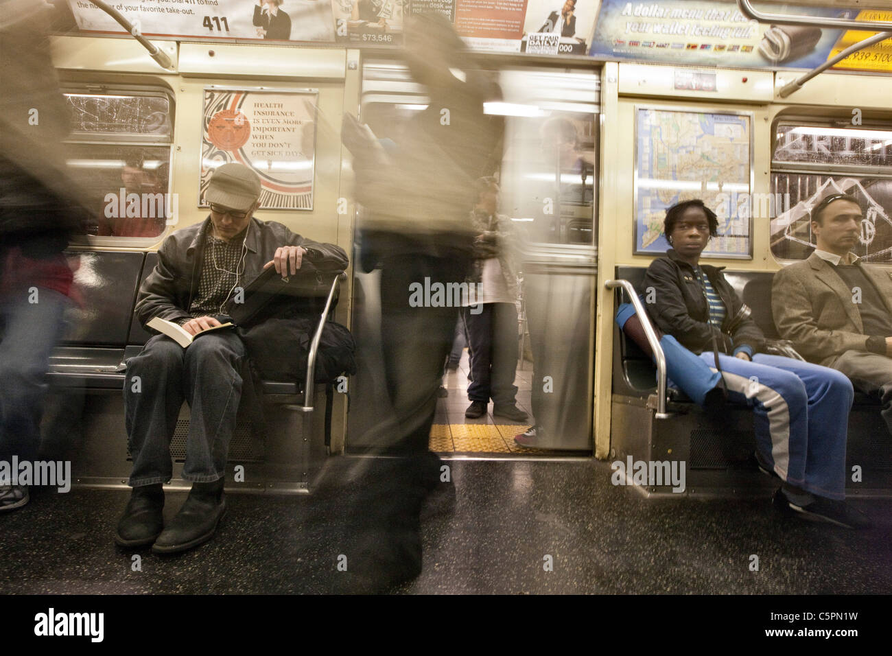 Commuters Board a New York Subway Train Stock Photo
