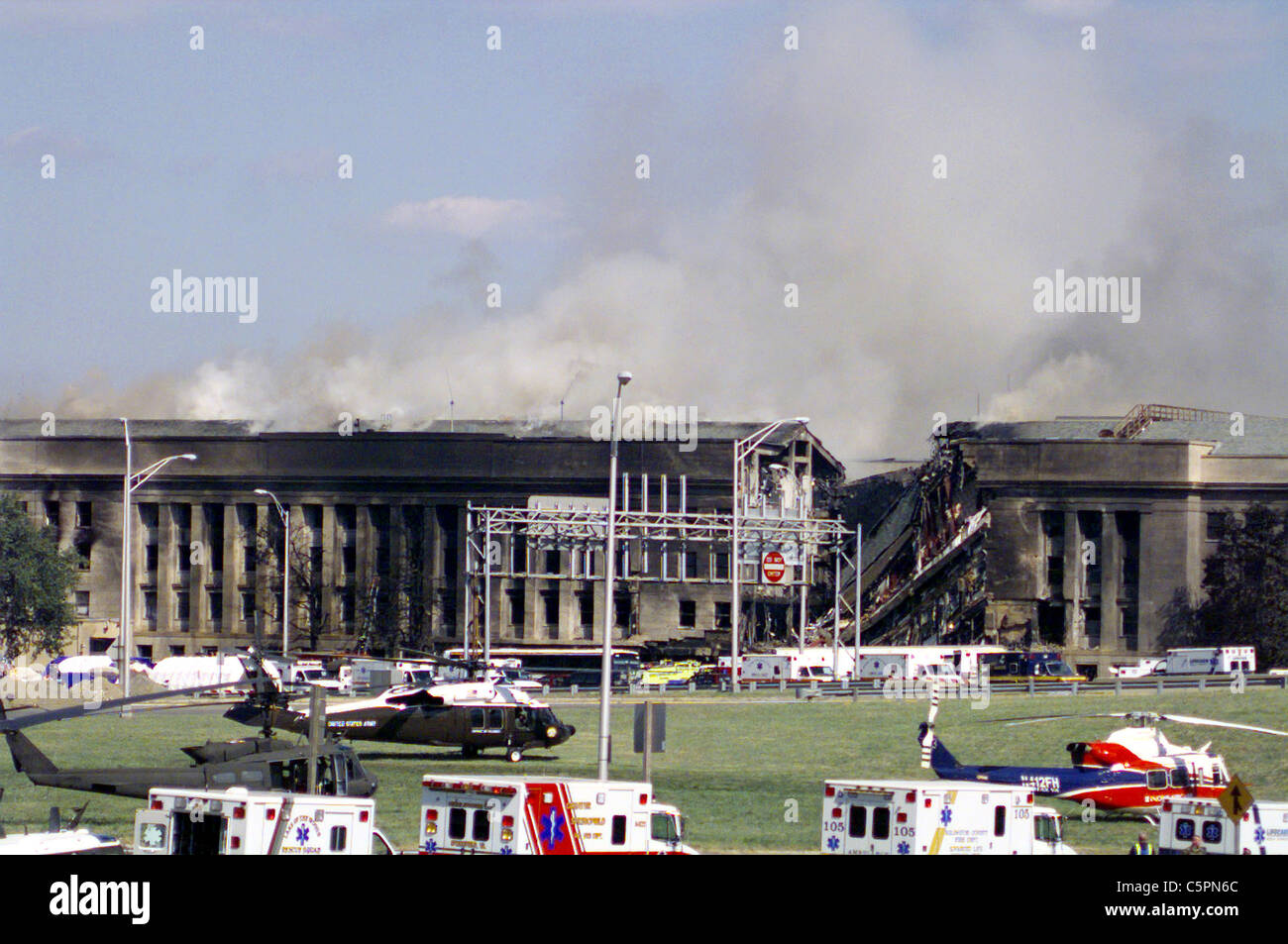 Smoke and flames continue to rise from the Pentagon following the terrorist attack of September 11, 2001 Stock Photo