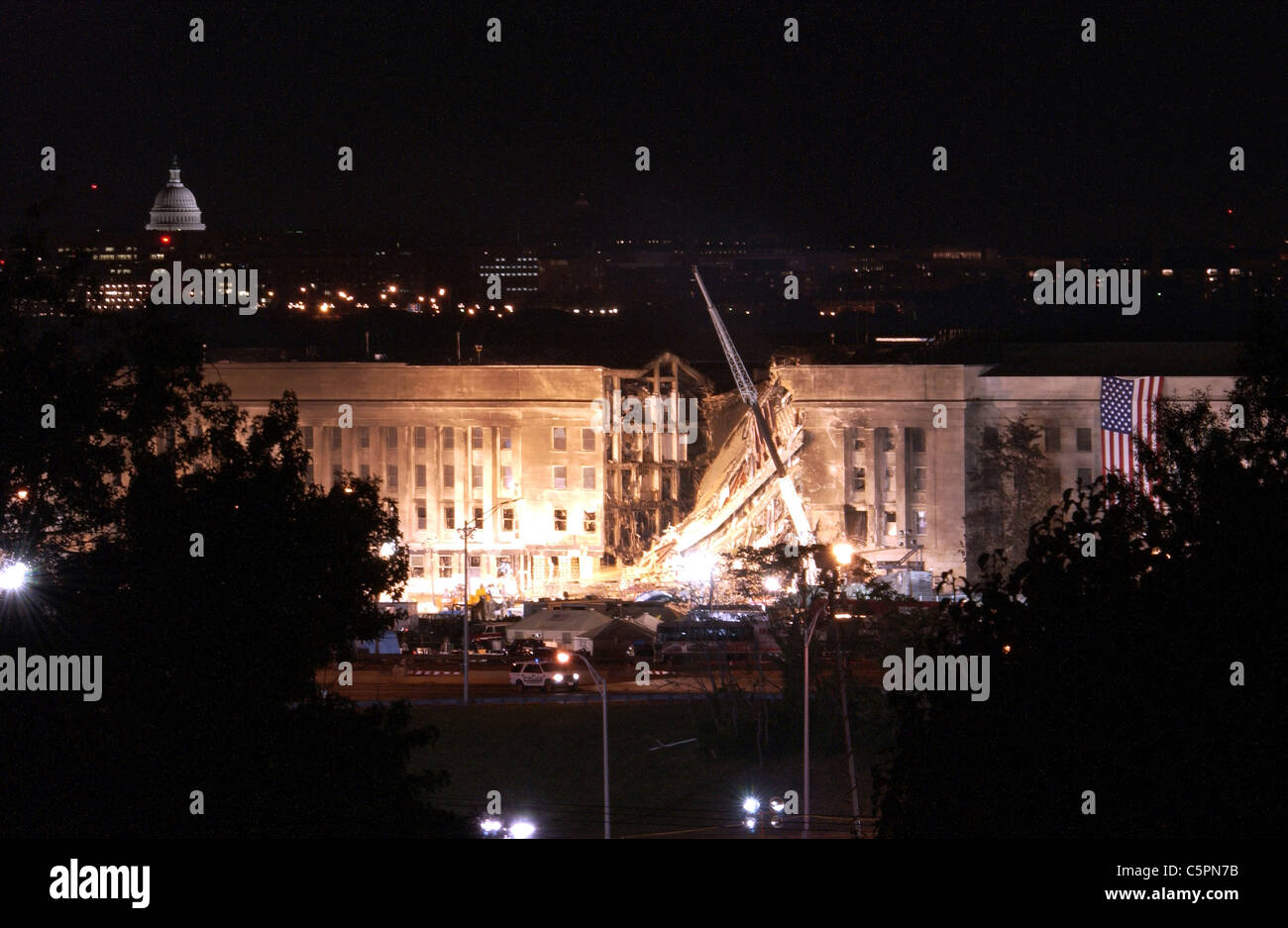 American flag on the wreckage of the Pentagon after the terrorist attacks of September 11, 2001 Stock Photo