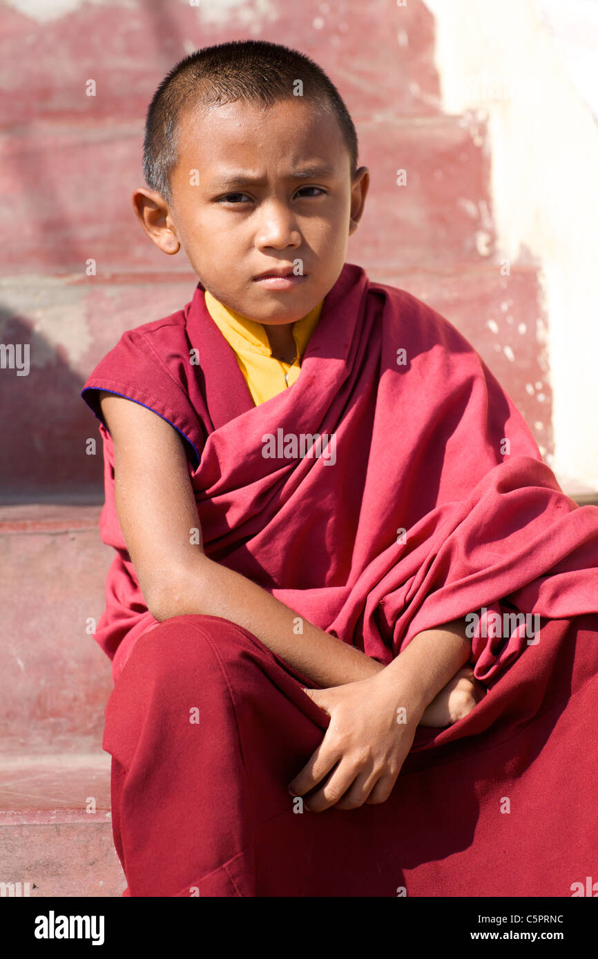 Nepalese boy who is learning to become a novice Monk in Pokhara, Nepal Stock Photo