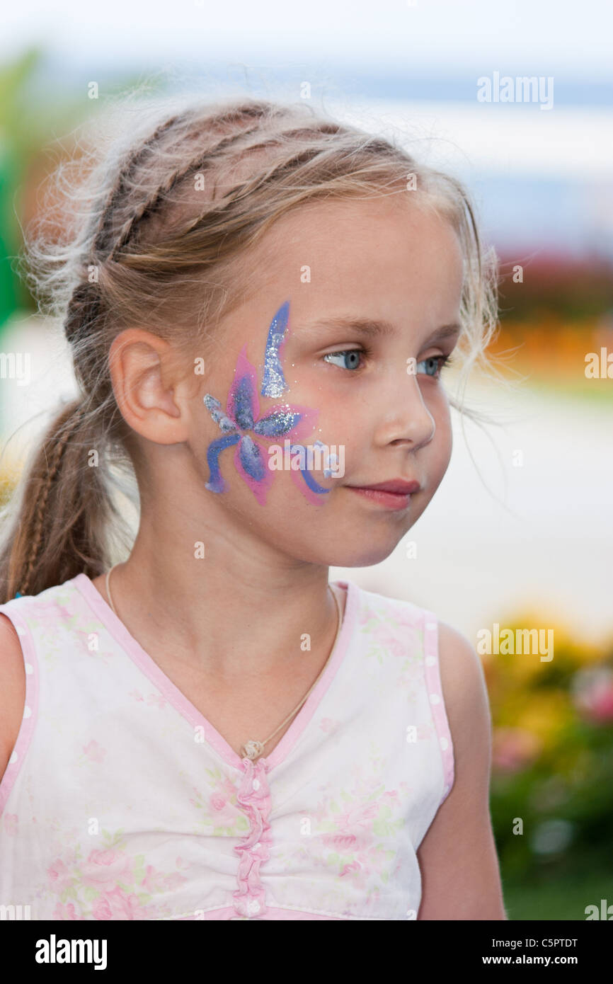 Portrait of a beautiful girl with flower paining on her face Stock Photo