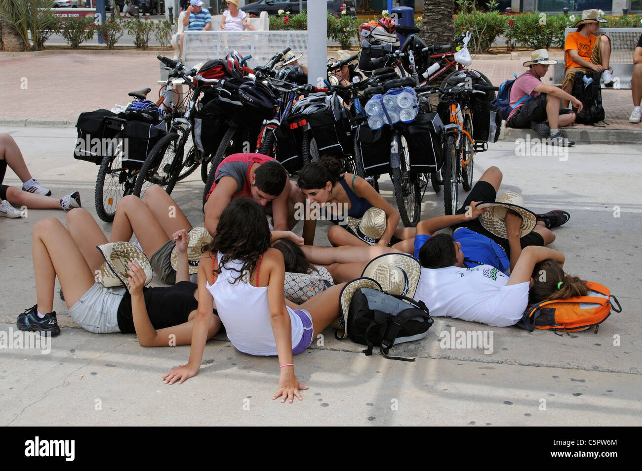 Cyclists resting on the quayside in Eivissa Port on the Spanish island of Ibiza Stock Photo