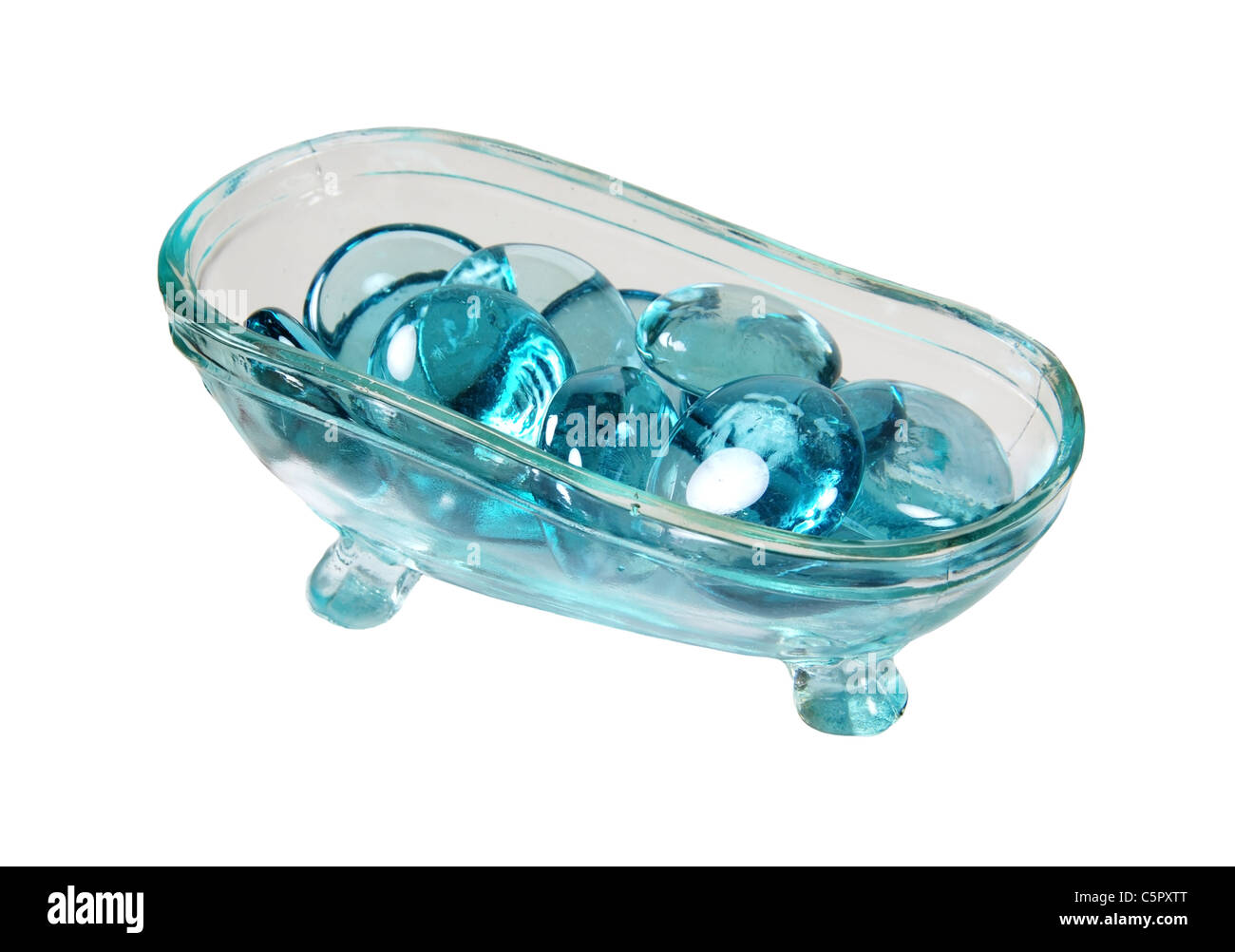 Claw footed crystal bathtub filled with glass water gems Stock Photo