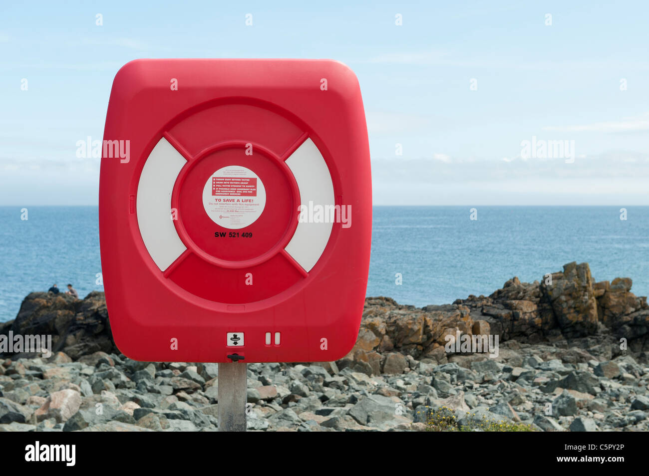 A life ring is pictured against a calm Atlantic Ocean off the coast of St Ives, Cornwall. Stock Photo