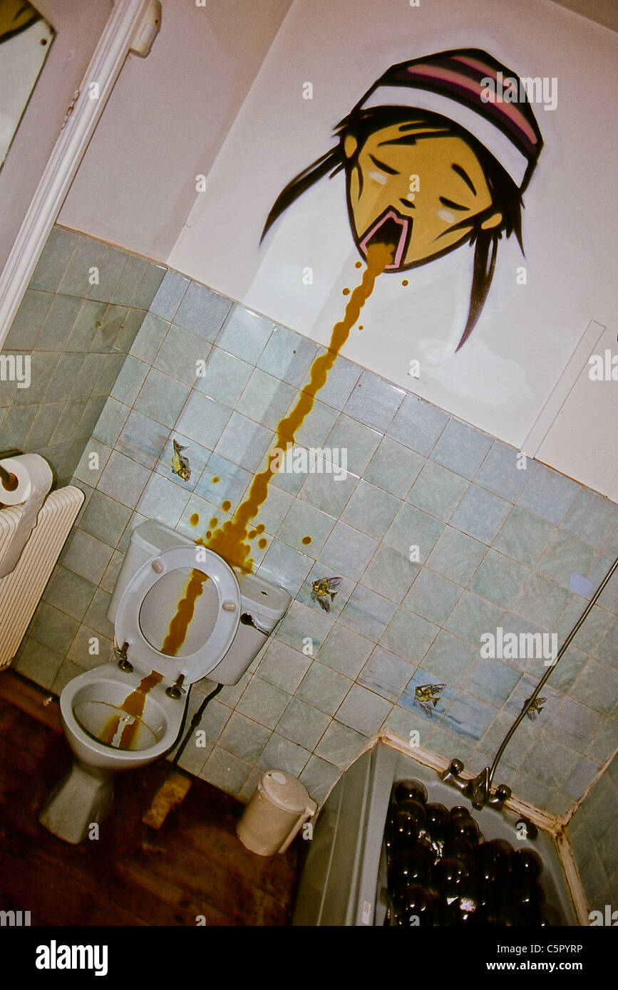 Art installation in house of cartoon youth throwing up in toilet Stock Photo