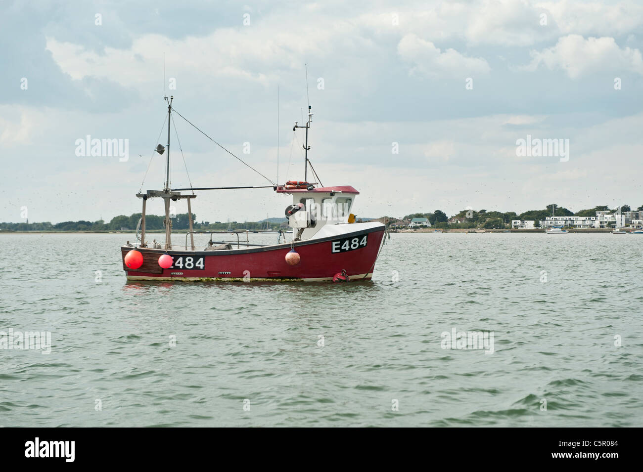 A fishing trawler boat moored in Christchuch Harbour, Dorset, England, UK. Stock Photo