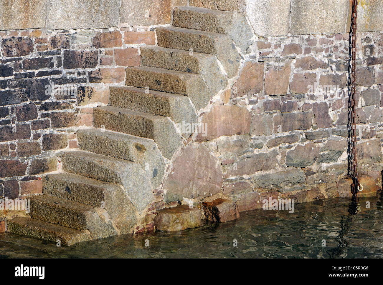 Massive stone steps on the  victorian Braye Harbour breakwater.  Alderney, Channel Islands, UK. Stock Photo