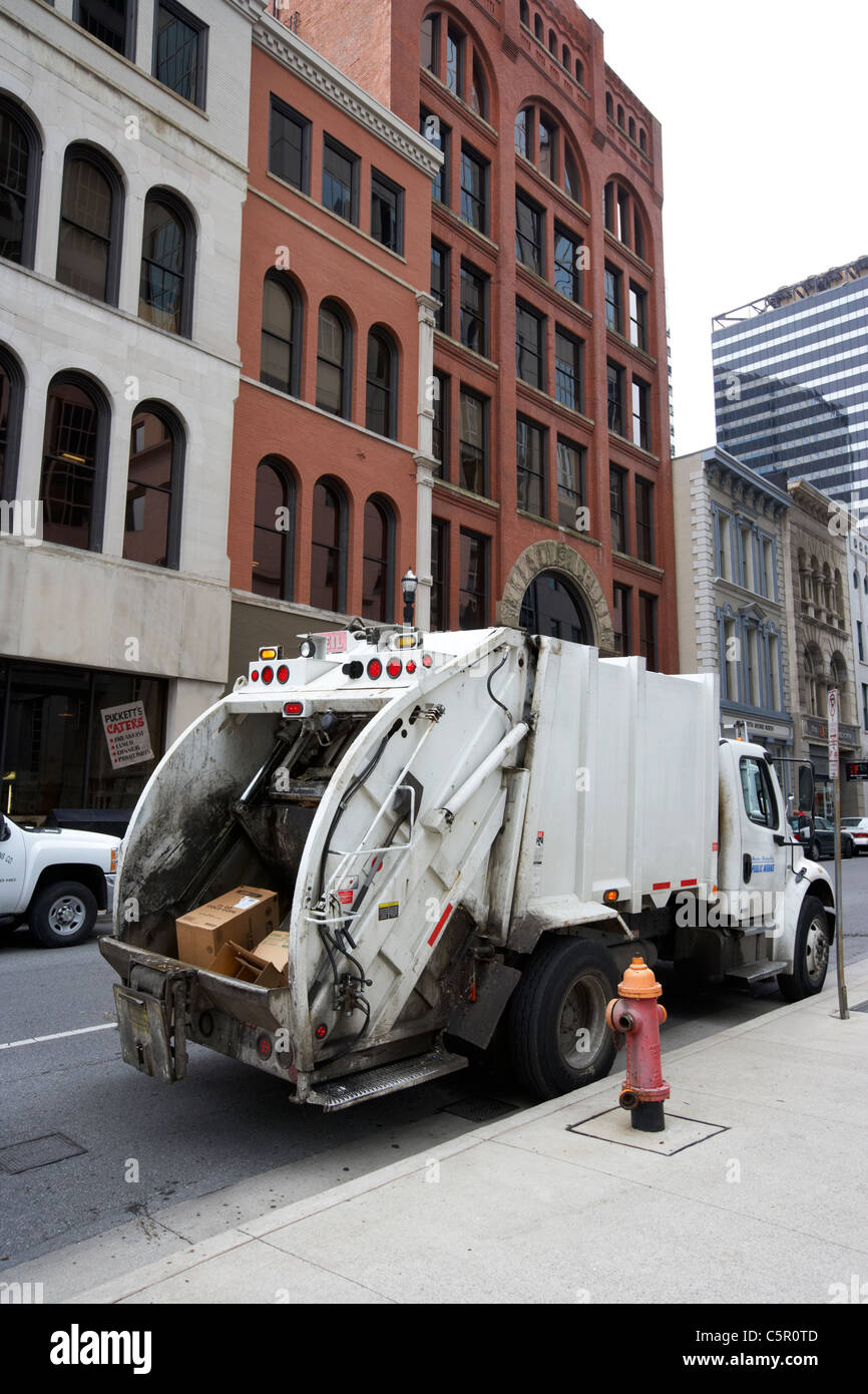 Council workers collecting rubbish recycling hires stock photography