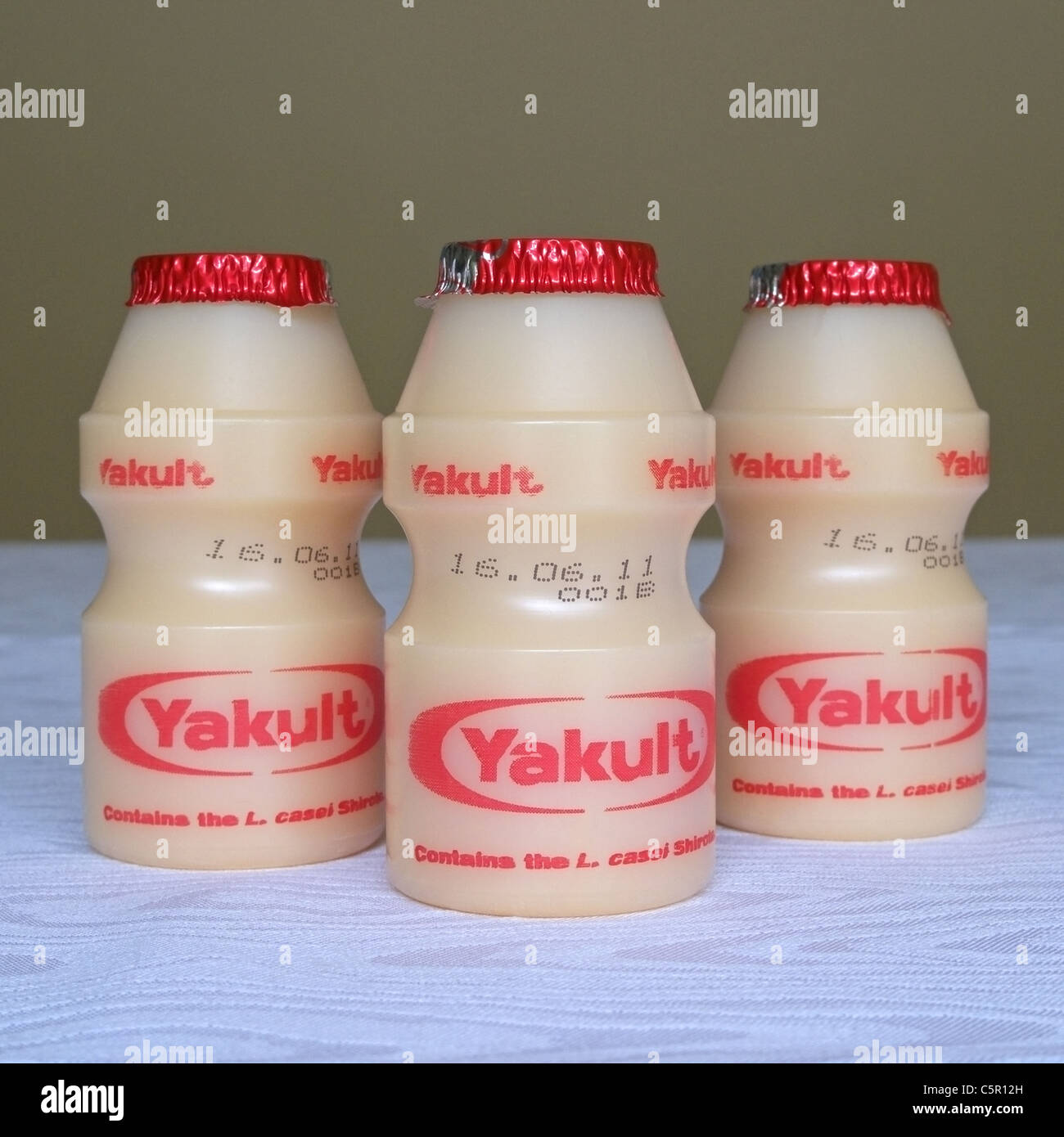 Bottles of Yakult Health Drink on a Tablecloth Stock Photo Alamy