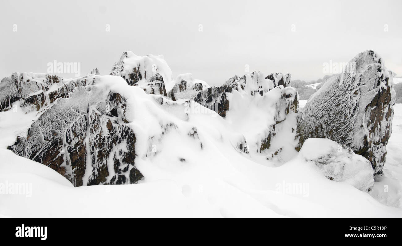 Ancient, Precambrian rocks on top of Beacon Hill, Charnwood Forest, after heavy snow. Stock Photo