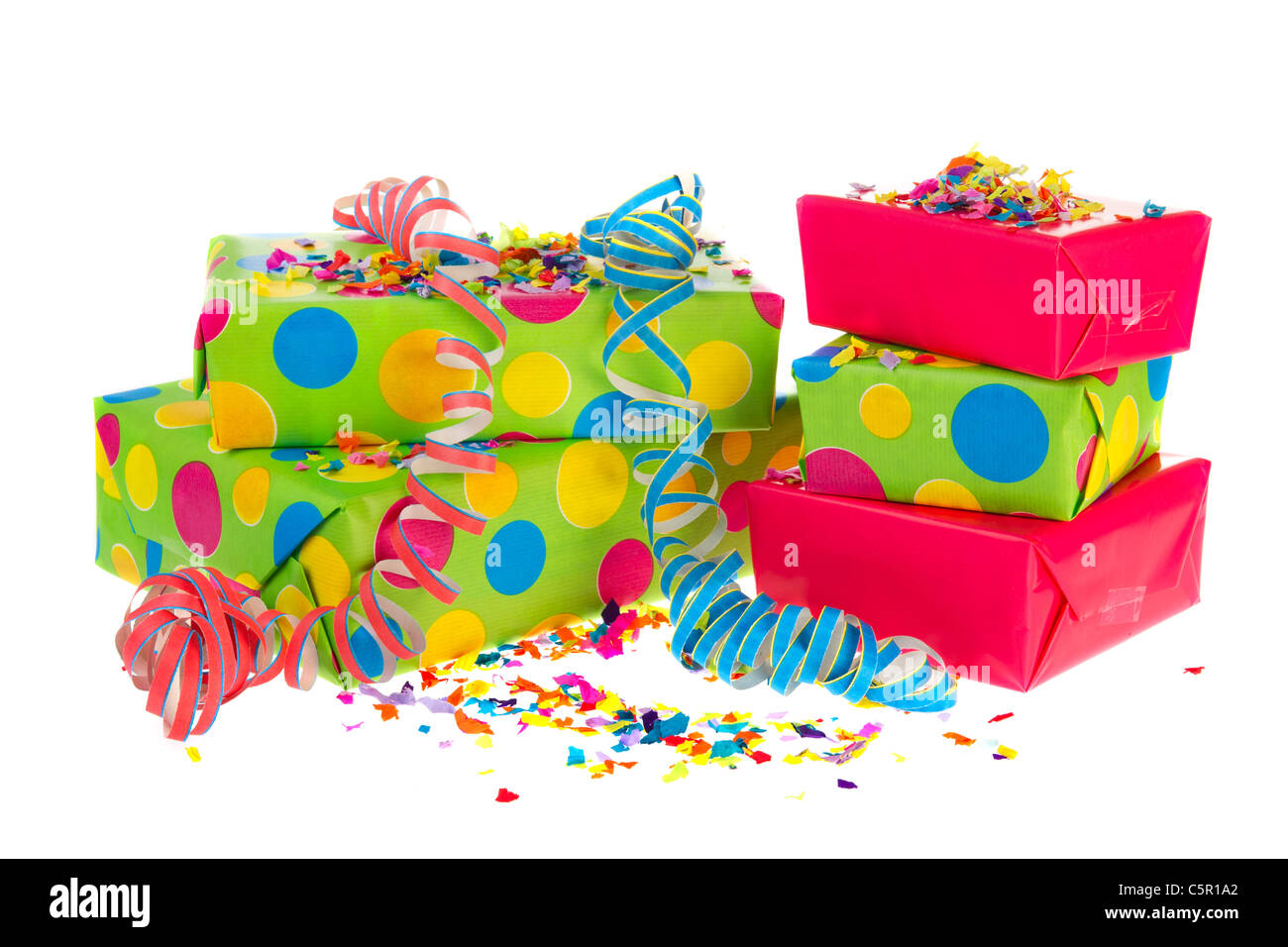 Colorful wrapped presents with party streamers and confetti Stock Photo