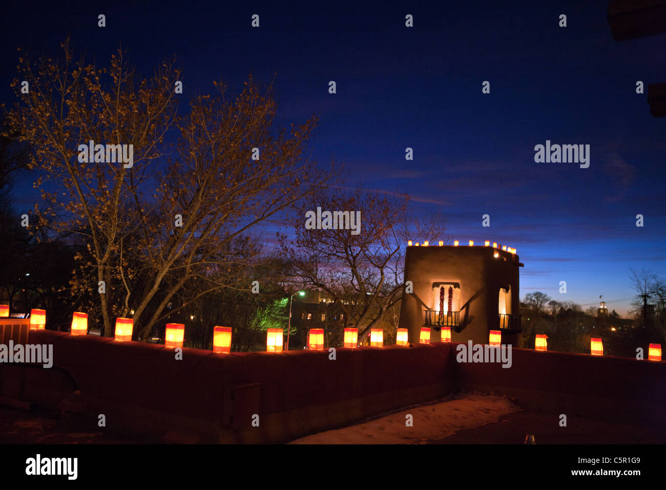 Farolitas line the roof top of the Inn on the Alameda at sunset, Santa Fe, New Mexico, United States of America Stock Photo