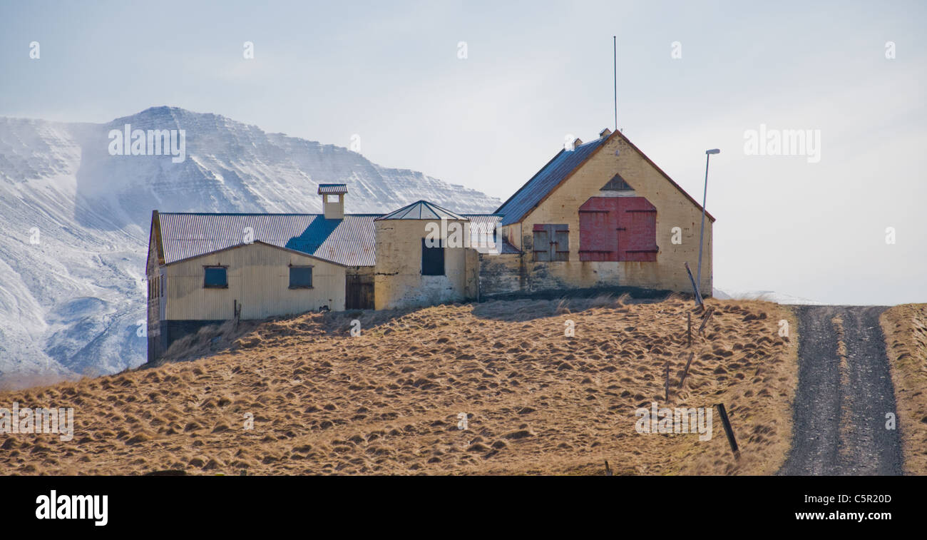 Farmhouse against mountain in Hvalfjörður, Iceland Stock Photo