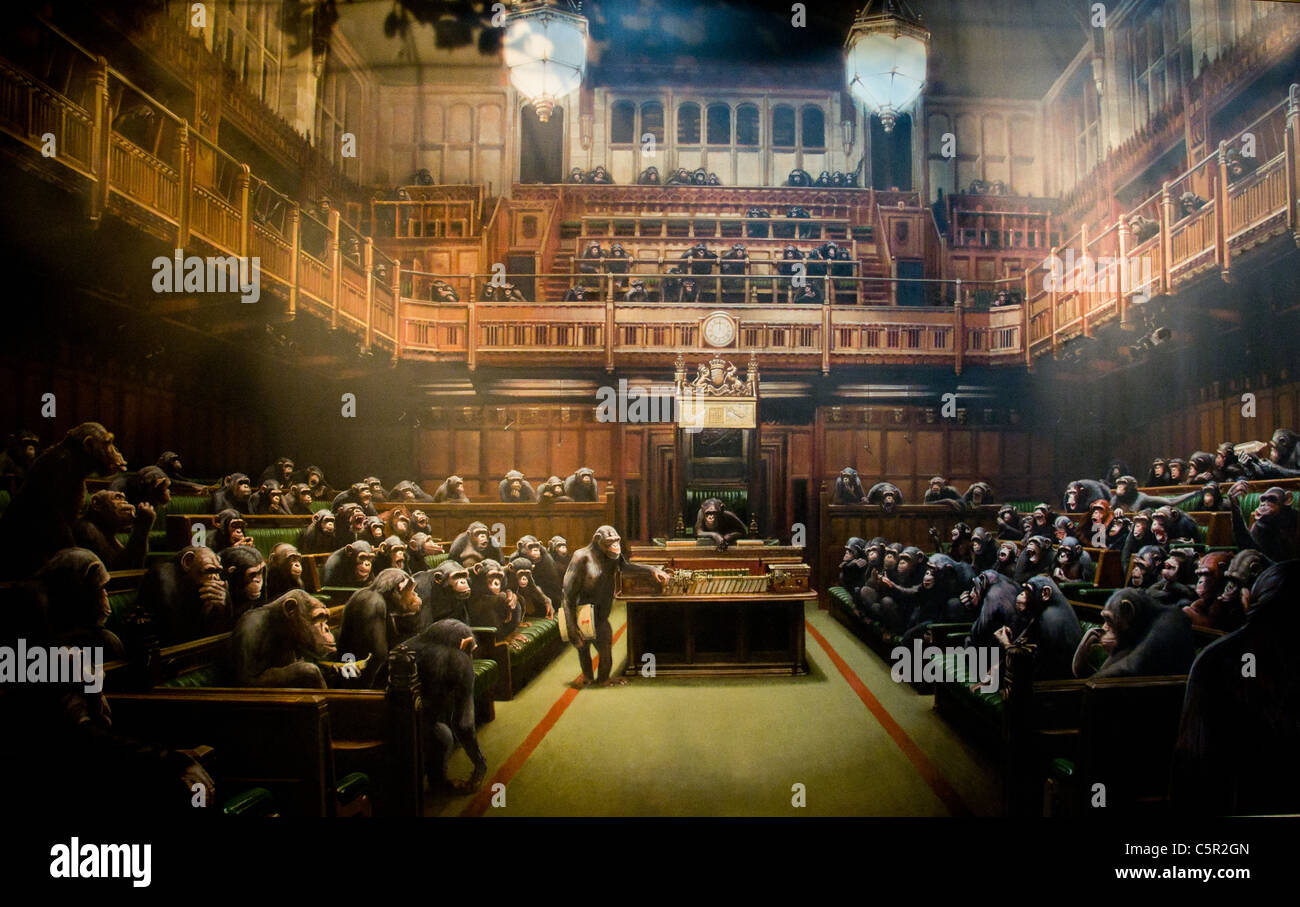 Banksy painting of the UK parliament at Westminster with monkeys debating in the House of Commons Stock Photo
