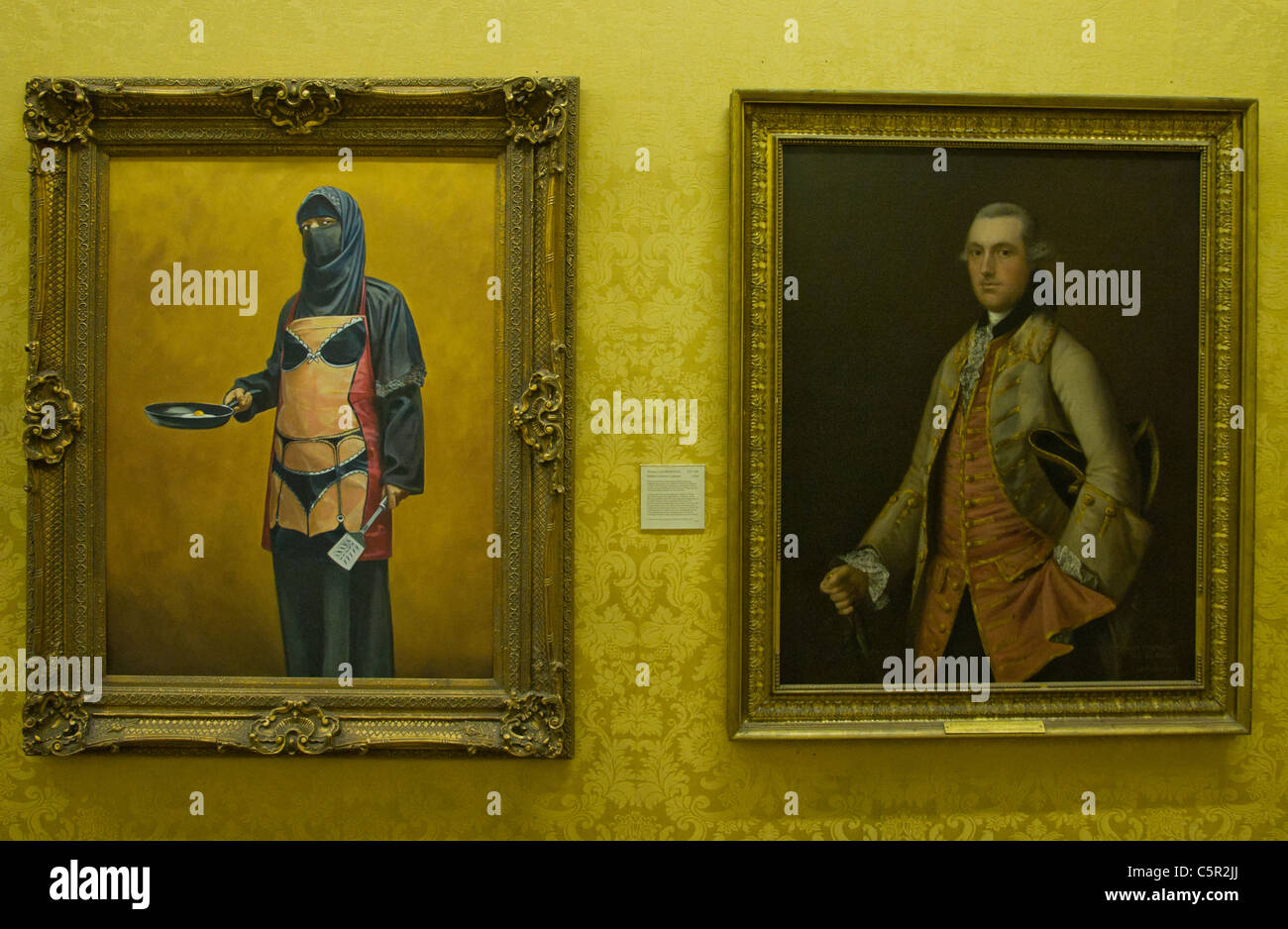Banksy picture of traditional portrait of aristocrat and muslim woman with full veil and 'bikini' apron Stock Photo