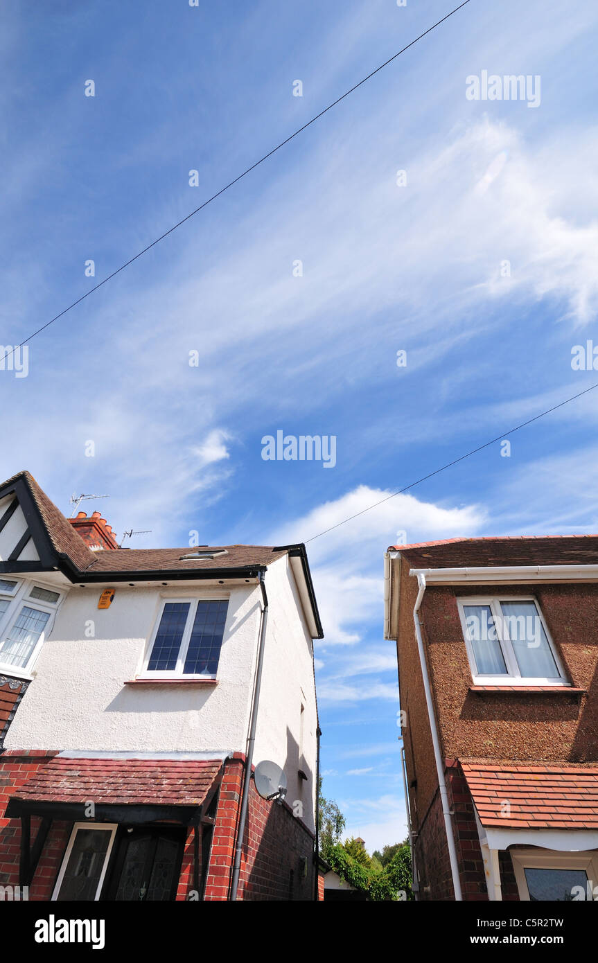 English style family houses against blue sky with cirrus clouds Stock ...