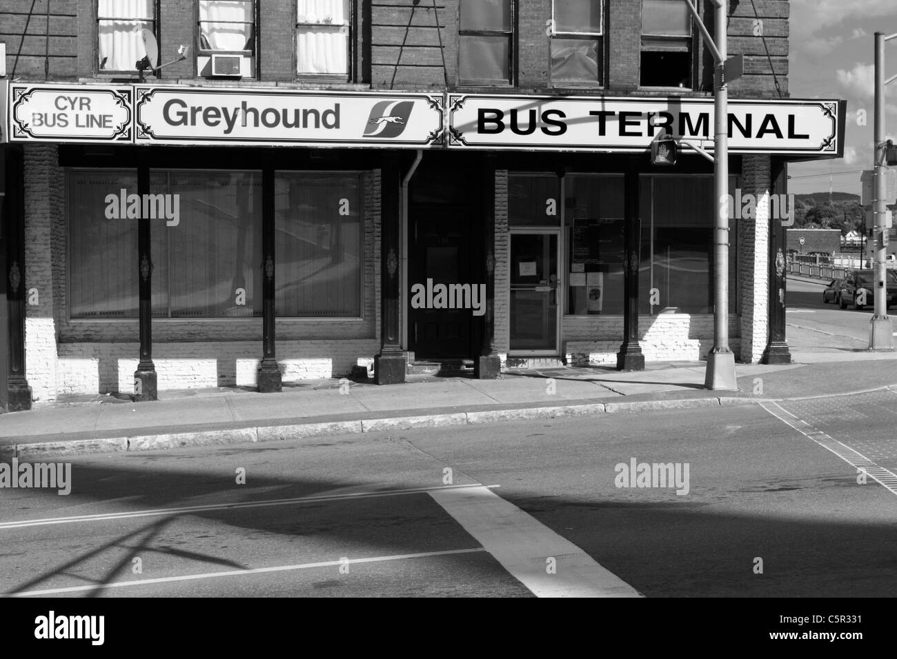 Black and white image of an old building housing the Greyhound Bus Terminal, Bangor, Maine, USA. Stock Photo