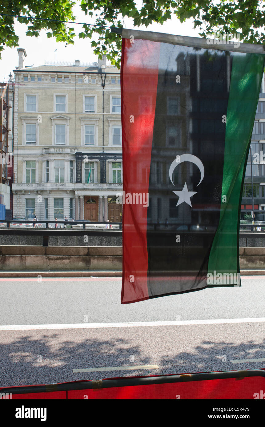 Libyan Rebel flag in foreground and Libyan embassy London behind Stock ...