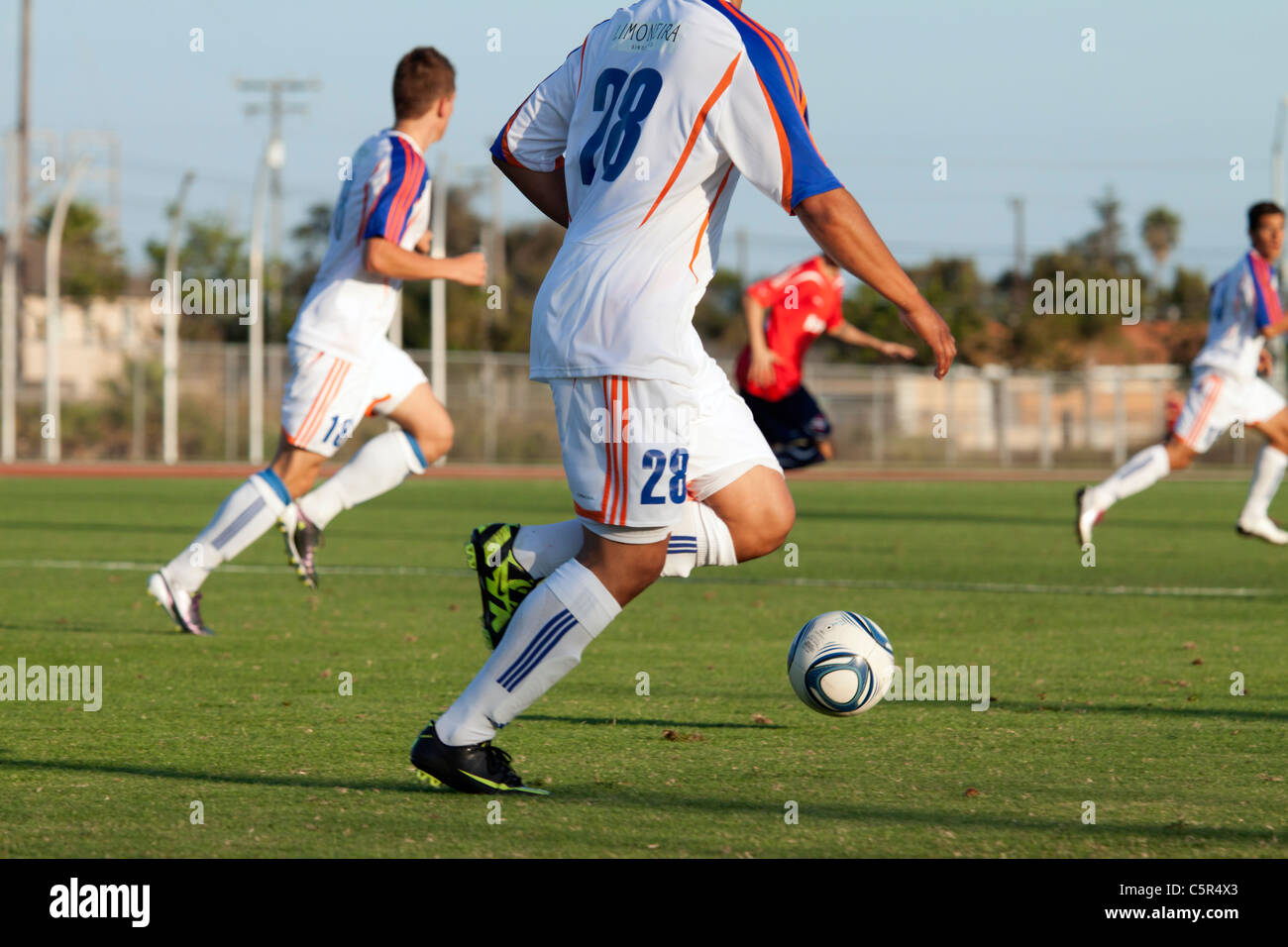 Soccer player moving the ball up field Stock Photo Alamy