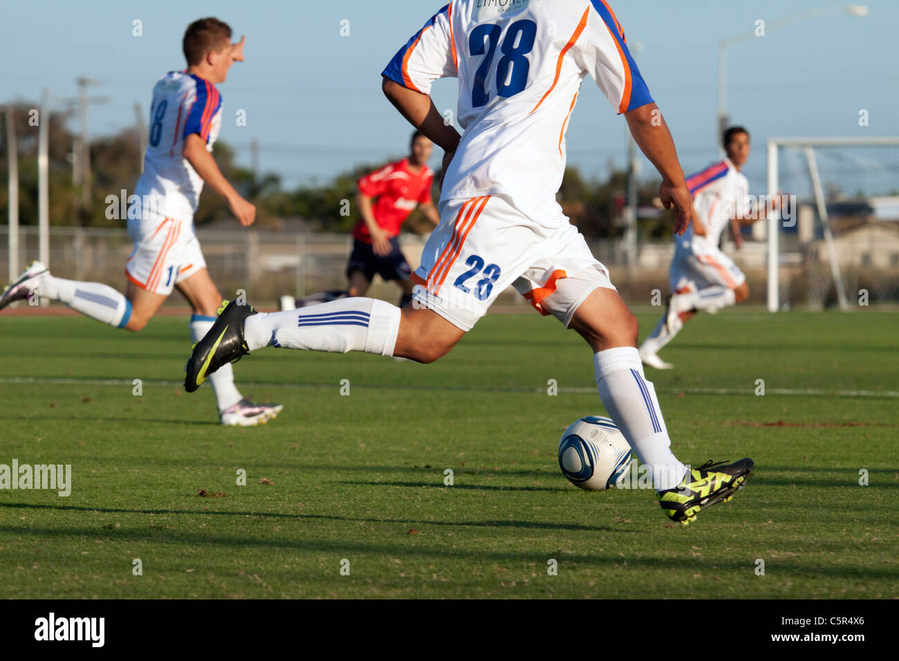 Soccer player moving the ball up field Stock Photo Alamy