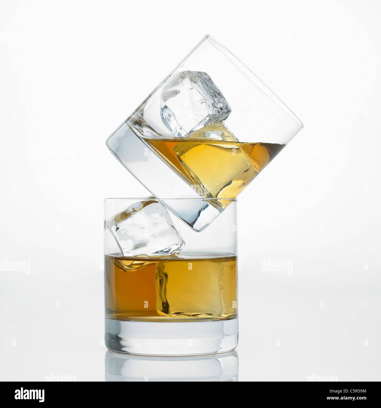 Liquor with ice in glass cups Stock Photo Alamy