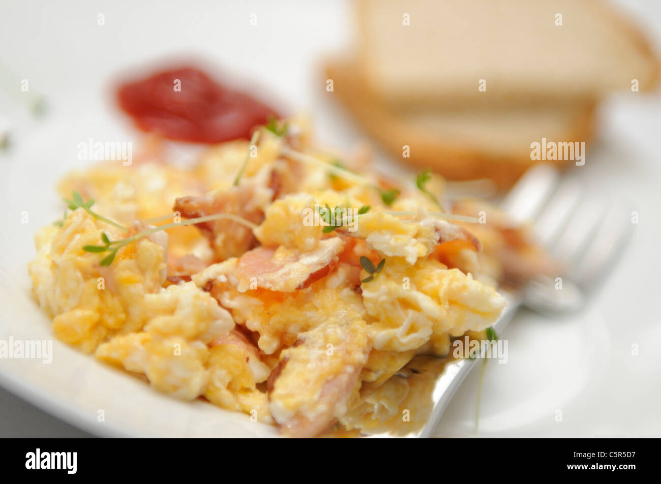Fresh fried scrambled eggs for breakfast Stock Photo - Alamy