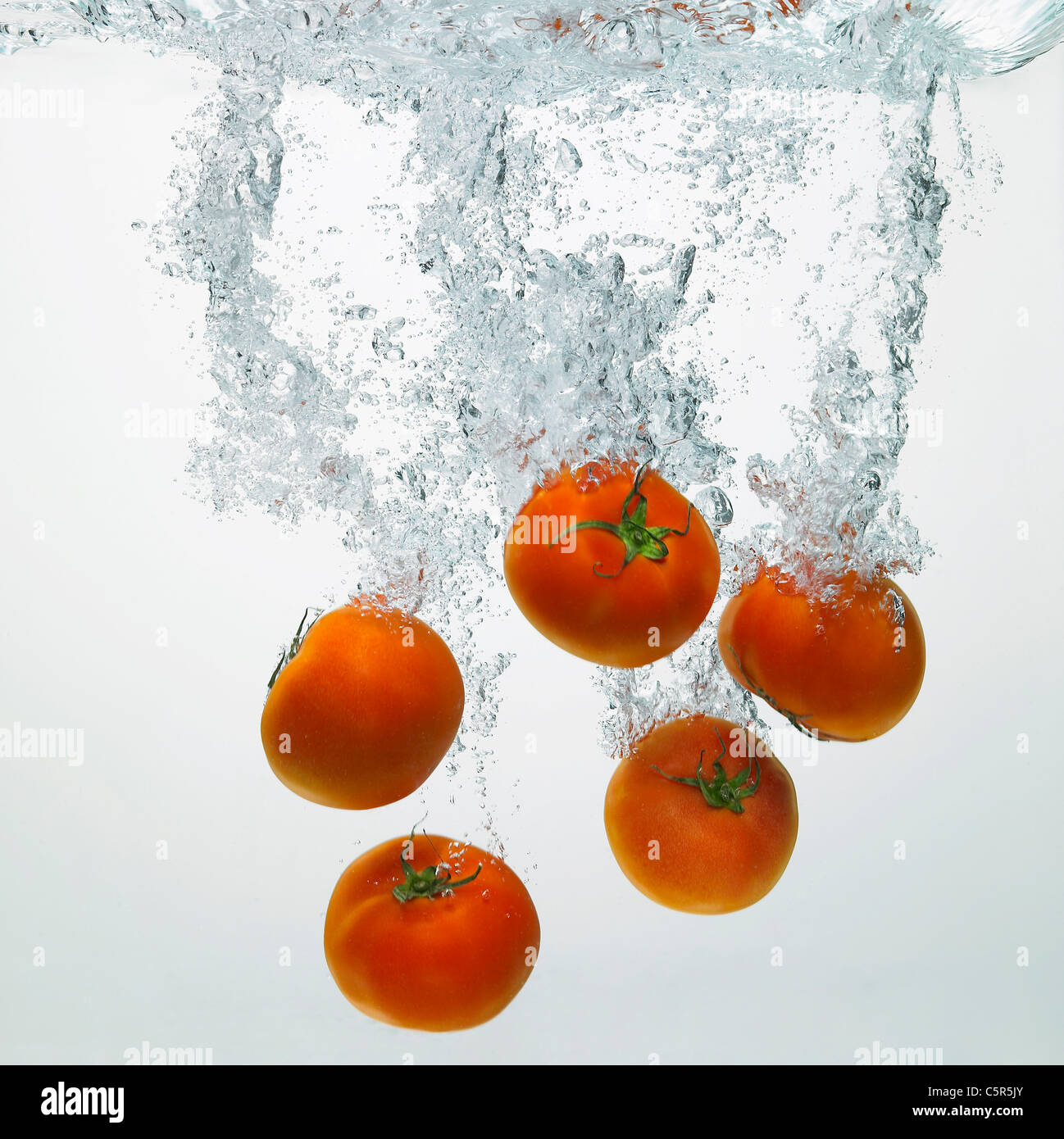 Tomatoes in water Stock Photo Alamy