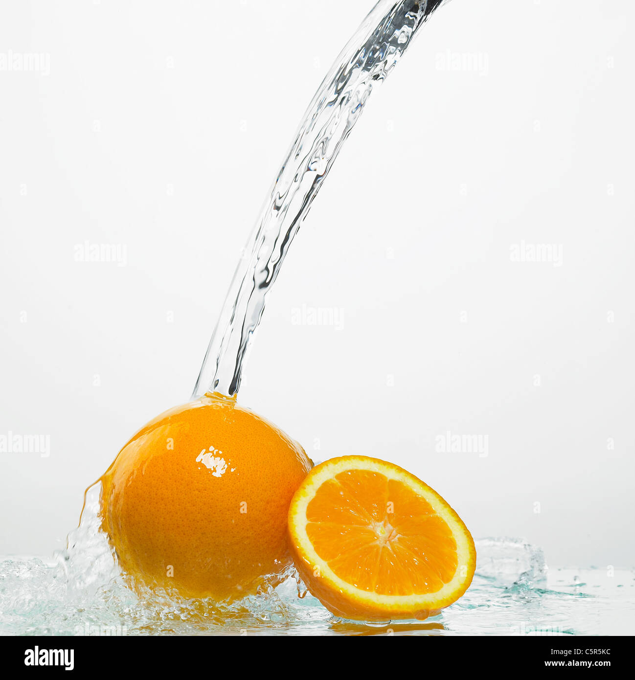 Water pouring down to oranges Stock Photo Alamy