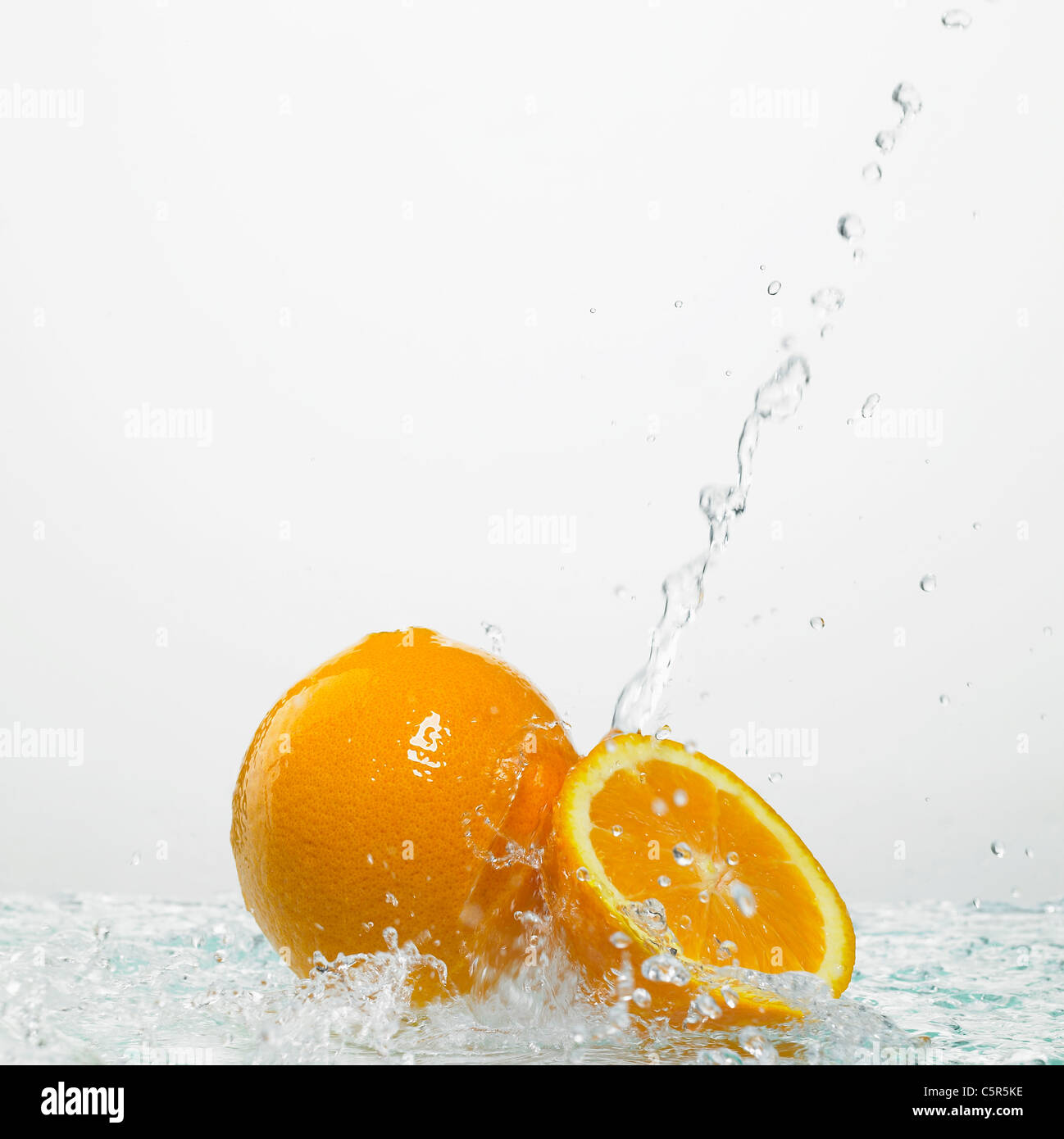 Water pouring down to oranges Stock Photo Alamy