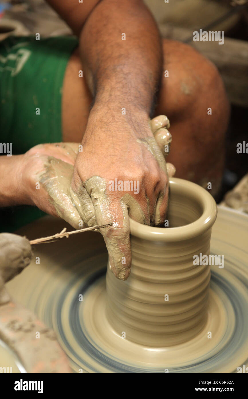 Hands throwing pot on pottery wheel Stock Photo Alamy