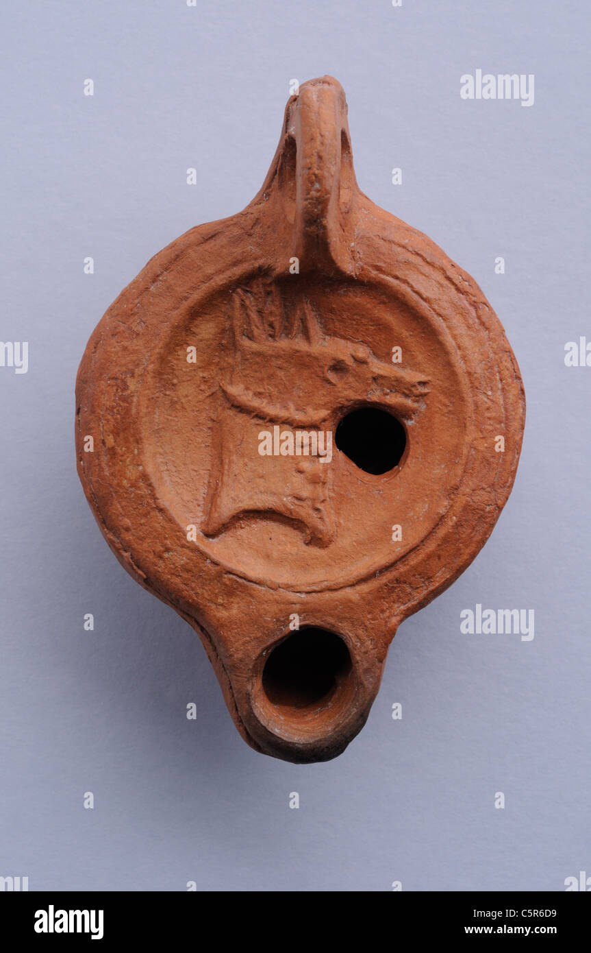 Disc oil- Lamps decorated with embossed horse . Roman period in Complutum . SPAIN Stock Photo