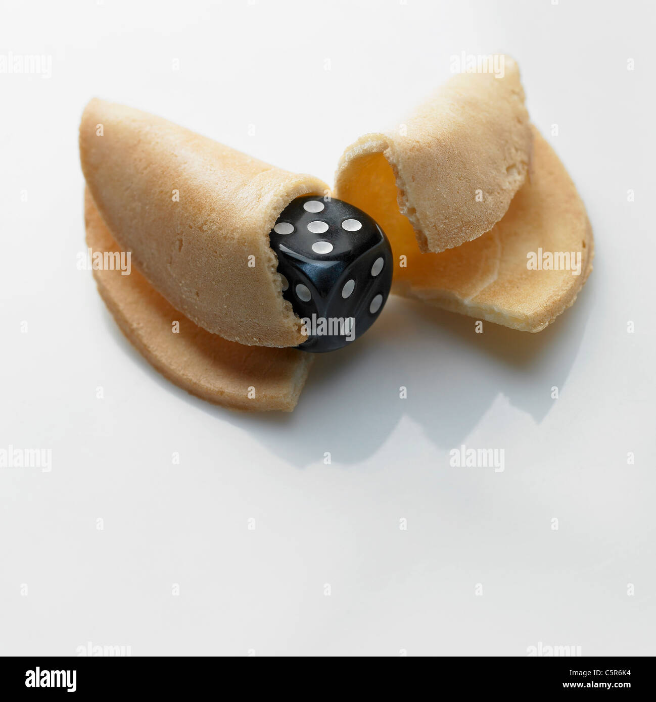 A dice inside a fortune cookie Stock Photo Alamy