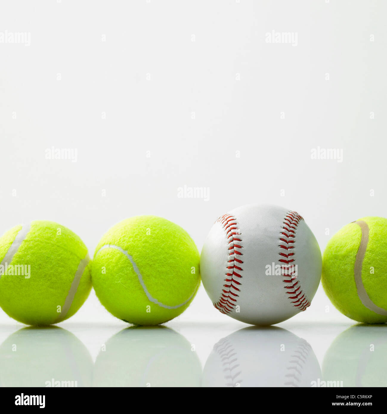 Tennis balls and a baseball Stock Photo Alamy