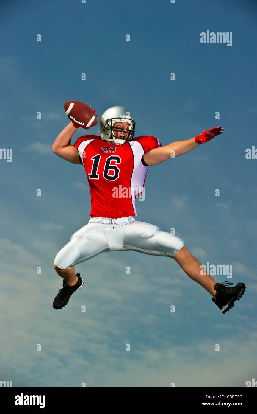 American football player gets ready to throw a pass Stock Photo Alamy