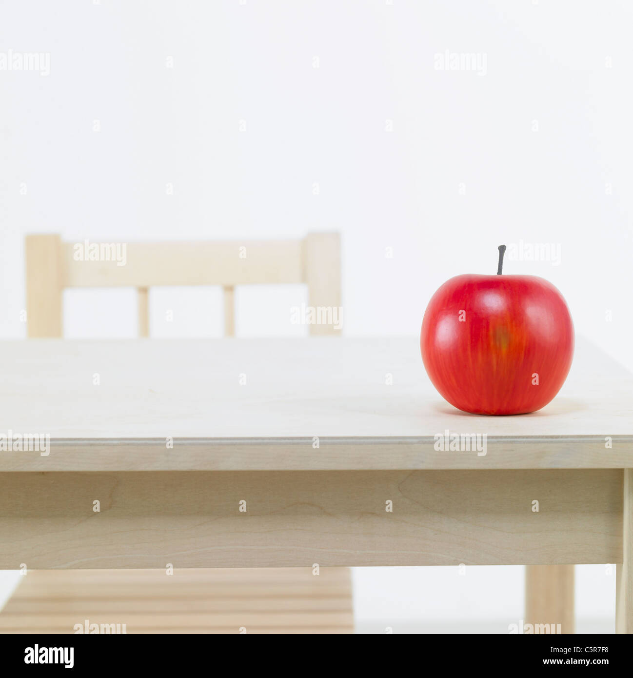 An apple on a desk Stock Photo Alamy
