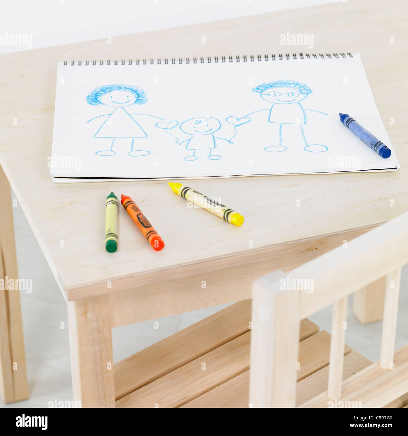 A sketchbook and crayons on a desk Stock Photo Alamy