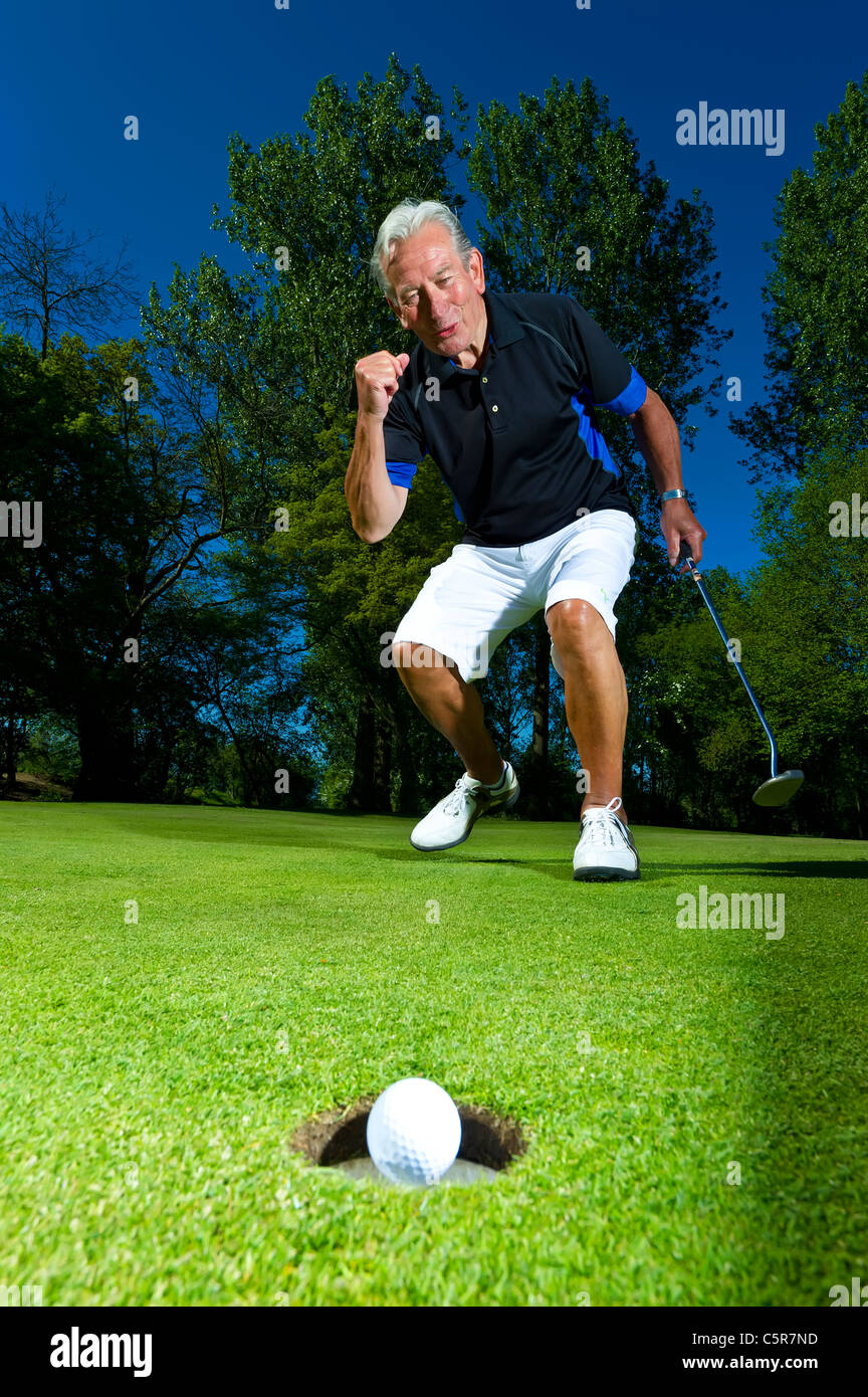 A Senior Citizen Celebrates Successful Putt Stock Photo Alamy