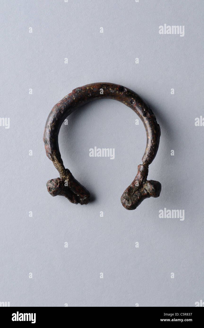 Omega fibula made of bronze . Roman period in Complutum . SPAIN Stock Photo