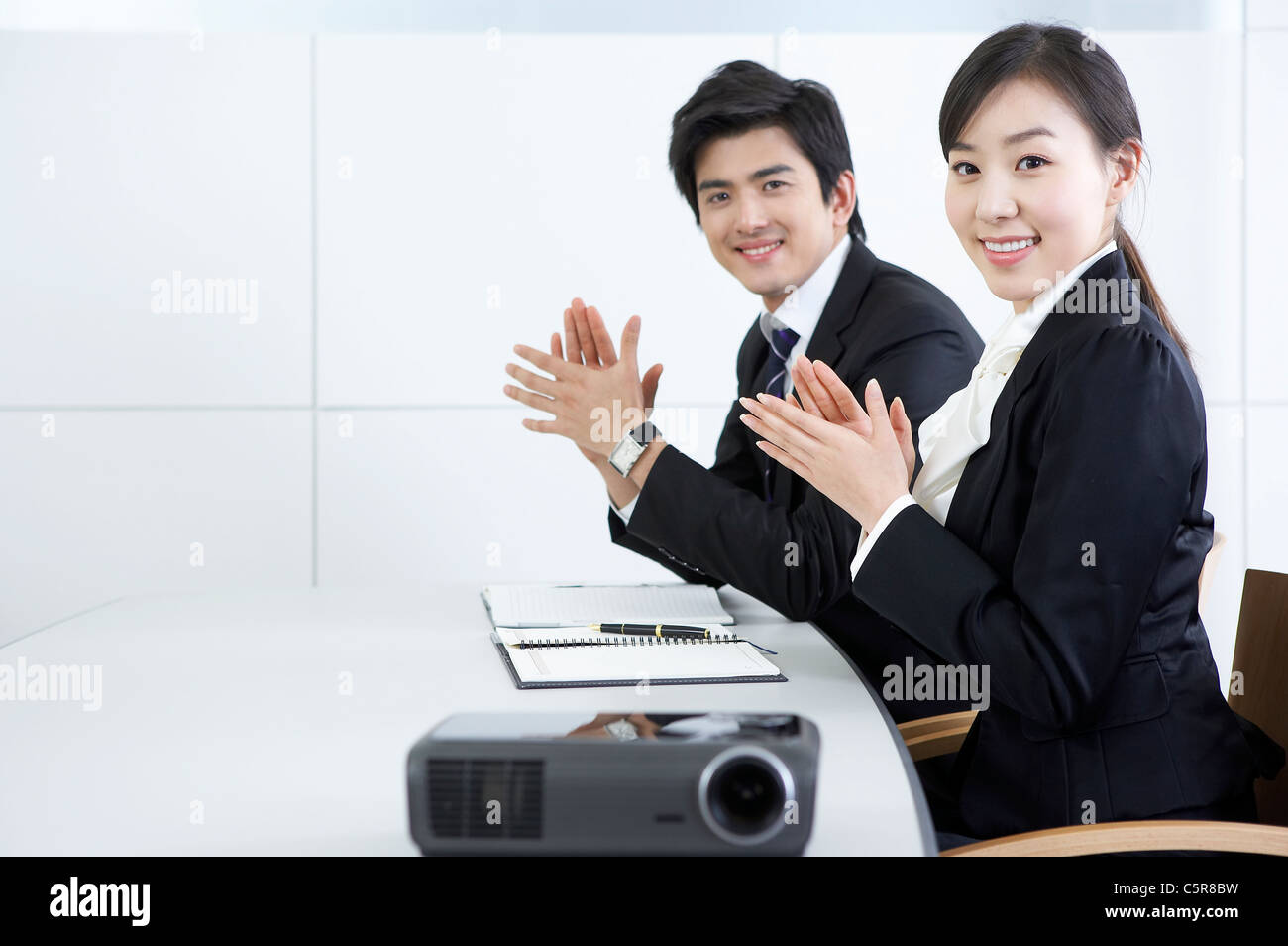Woman clapping hands desk hi-res stock photography and images - Alamy