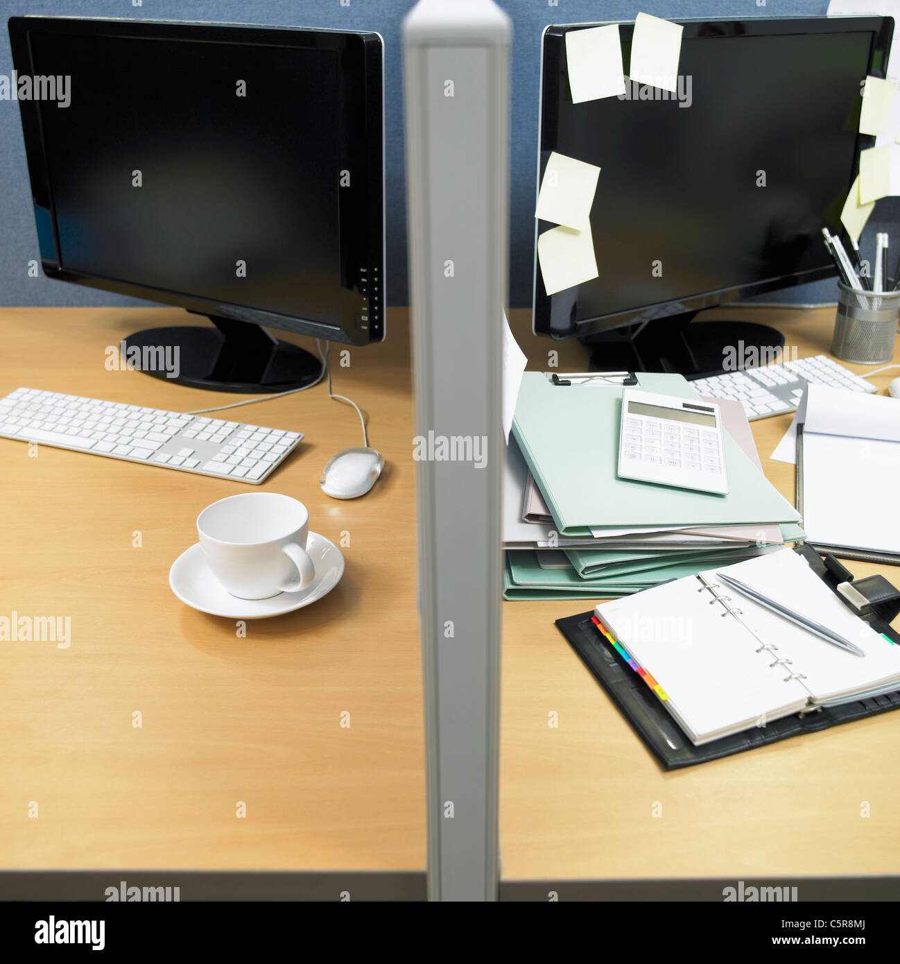 Organized and disorganized desks Stock Photo
