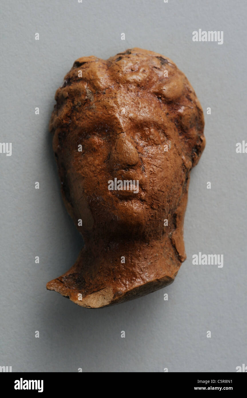 Head female of terracotta figurine with roman hairstyle . Roman period in Complutum . SPAIN Stock Photo