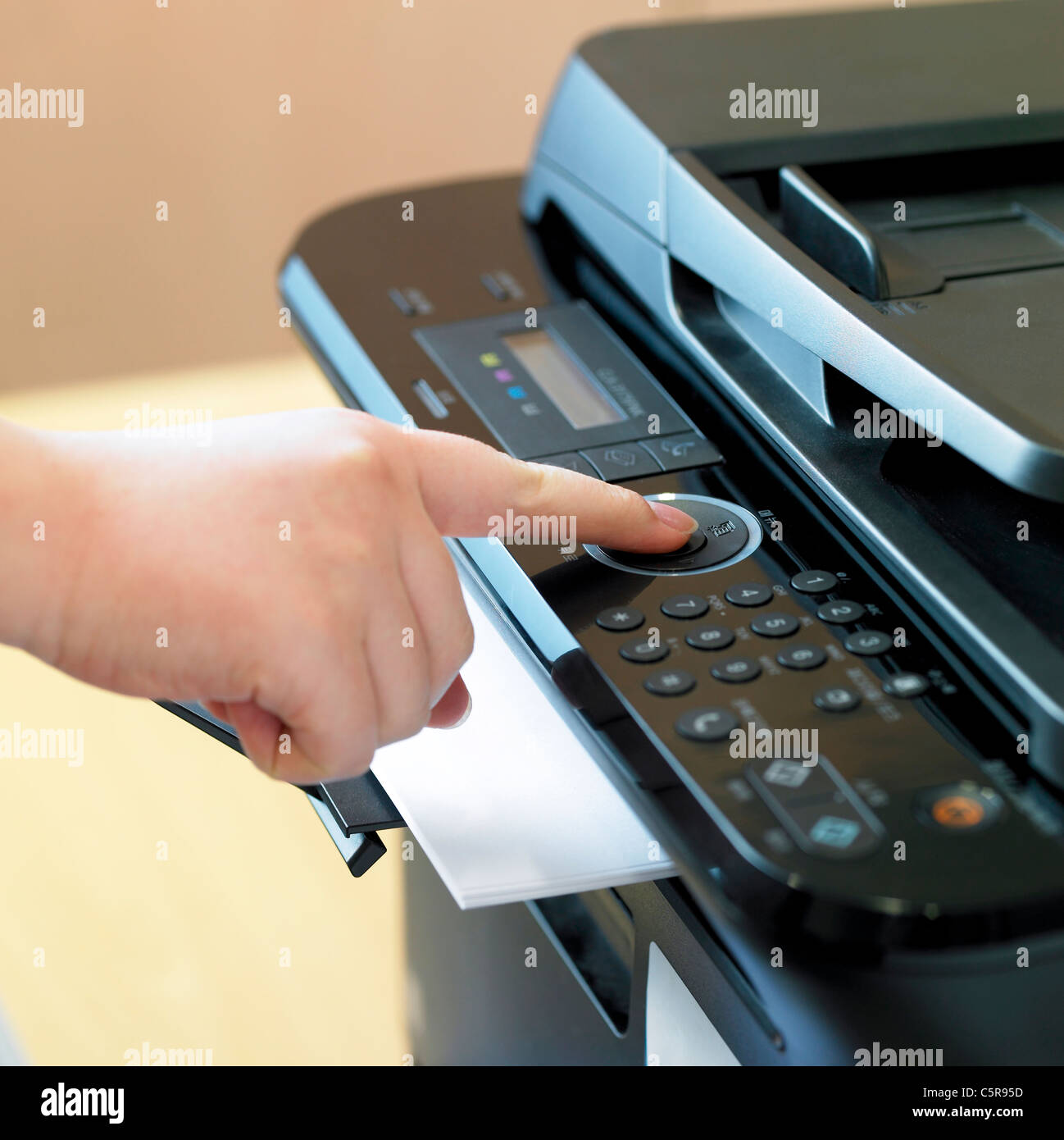 A person using copy machine Stock Photo - Alamy
