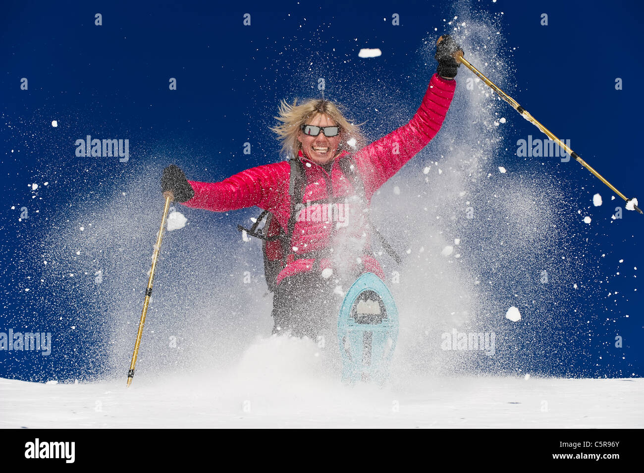 Snowshoeing in deep fresh powder and having fun. Stock Photo