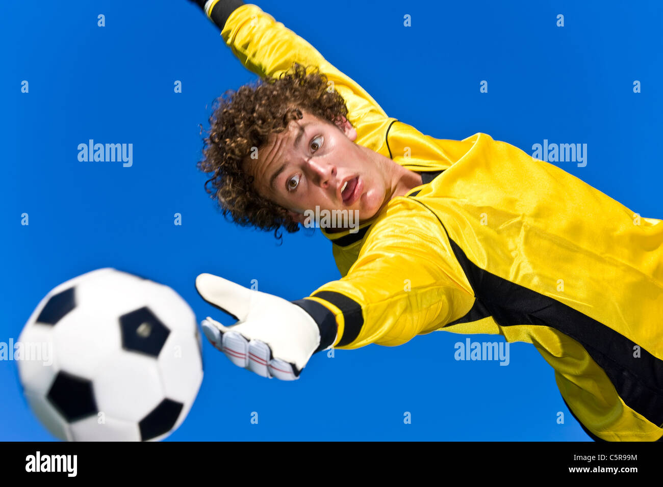 A soccer goalie tries to make the save Stock Photo Alamy